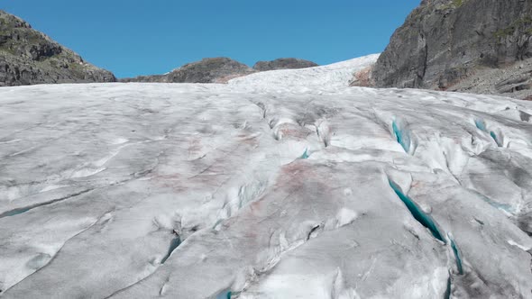Aerial: end of glacier melting and fracturing, global warming melting ice sheet