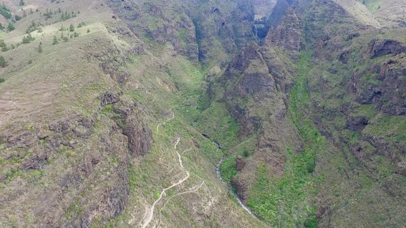 Aerial drone shot of a big gorge over a mountainous / 21 Full Hd