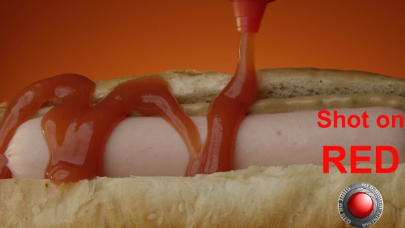 Hot Dog Ketchup Pouring on Hotdog