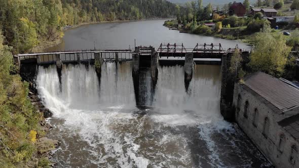 Dam with Flowing Water on River Aerial View