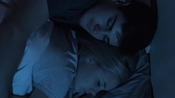 Sleeping Couple Night Rest Hugging in Bed Vertical