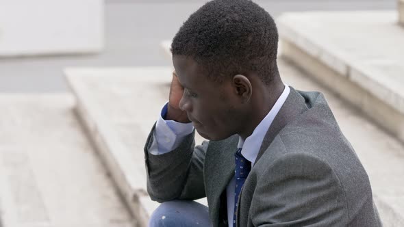 Pensive sad lonely American african business man. job problems