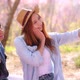 Slow motion romantic moment of young Asian couple dating while pink Sakura tree. - VideoHive Item for Sale
