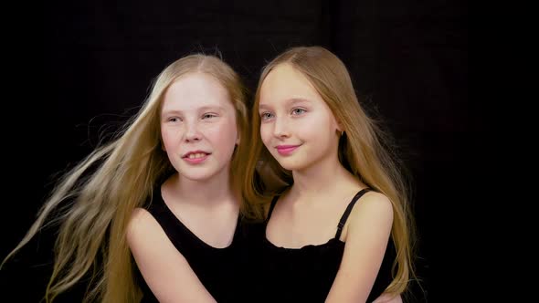 Portrait of Beautiful Young Girls Standing Isolated Cut at Black Dark Background