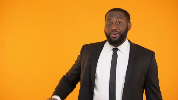 Black Manager in Suit Showing Briefcase Full of Dollars, Banking Service, Credit