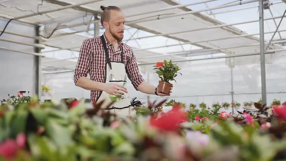 Young Farmer Guy Working in the Garden