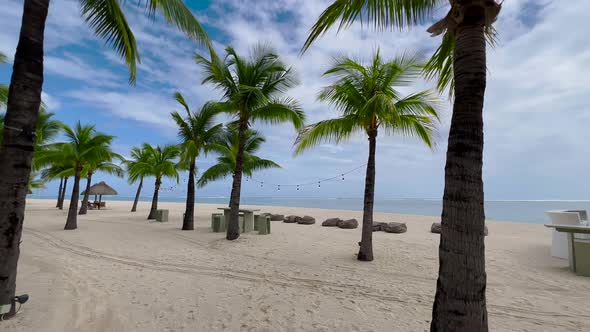 Gorgeous Shot of a Tropical Beach with White Sand Palm Trees and Turquoise Water on Mauritius Indian