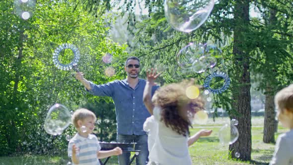 Little Children Playing at Outdoor Bubble Show alt
