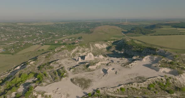 aerial view of group of people running in quarry during sunrise