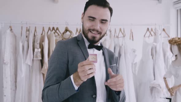Funny Groom Man Wearing Wedding Clothes Dance in Dressing Room
