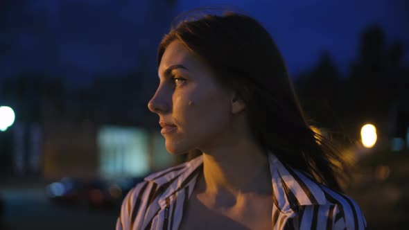 Portrait of Young Beautiful Woman at Night