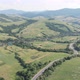 Drone filming of the Carpathian mountains in Ukraine. Cars are driving along the winding road - VideoHive Item for Sale