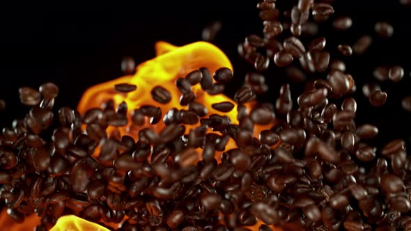 Super Slow Motion Shot of Flames and Coffee Beans Explosion on Black Background at 1000Fps