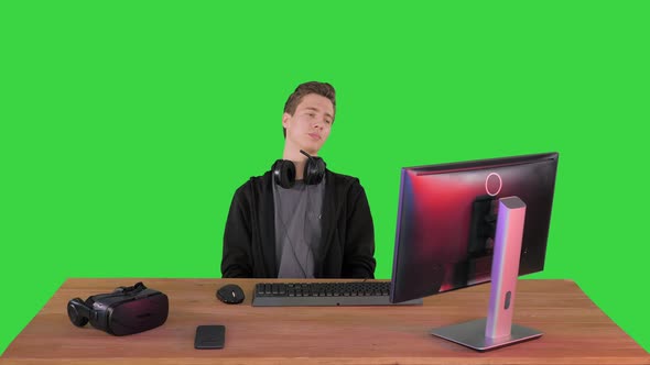 Upset Gamer Expressing Disappointment Watching Online Game on a Green Screen, Chroma Key.