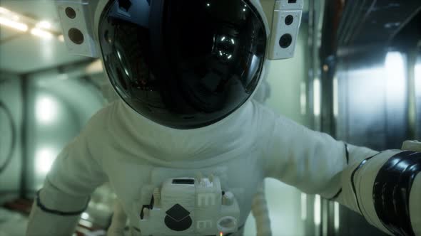 Astronaut Inside the Orbital Space Station