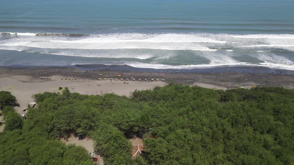 Aerial view of people holiday in parangtritis beach, Indonesia