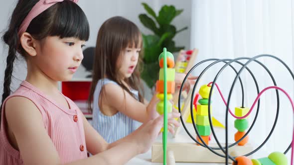 Mixed race Group of young children student playing together in school.