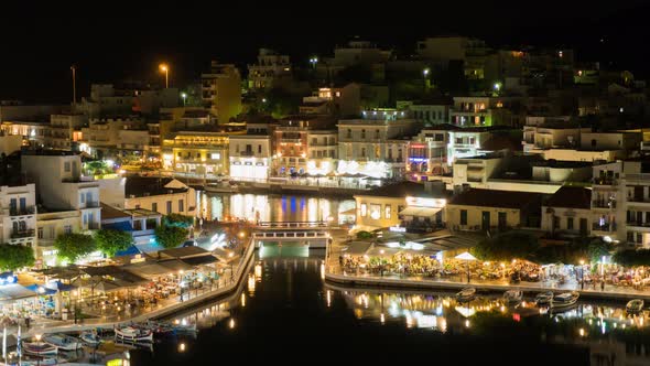 Time lapse of Night Greek city. Landscape  lake Voulismeni and Agios Nikolaos