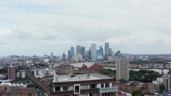 Aerial Panoramic View of Town District at Thames Rive Bank and Skyscrapers in Canary Wharf Financial