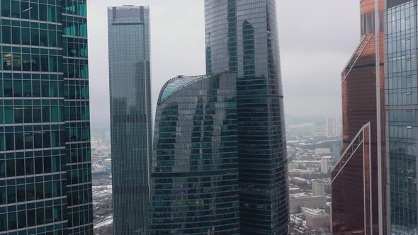 Aerial Drone Shot of Moscow City Skyscrapers at Cloudy Winter Day, Backwards Motion of Camera.