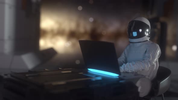 Astronaut Works on His Science Laptop in Futuristic Spaceship