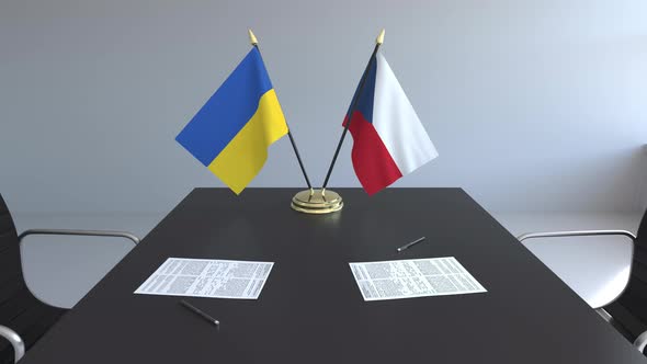 Flags of Ukraine and the Czech Republic on the Table