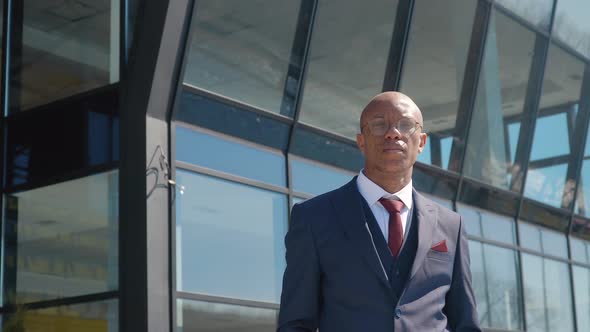 Pensive Elegant African American Businessman Looking at Camera Close Up