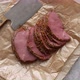 Delicious Peppered Roast Beef Pastrami Slices on Paper with Grains of Coloured Pepper - VideoHive Item for Sale