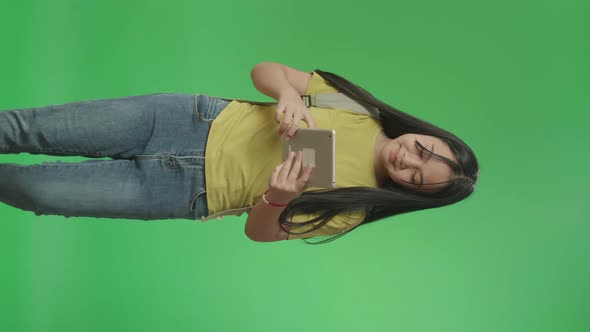 Asian Girl Student Use Tablet And Walking To School On Green Screen Chroma Key