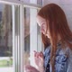 Sad Teenage Girl Looking Out Window at Home - VideoHive Item for Sale