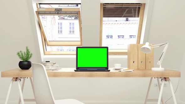 Laptop with track green screen on desk