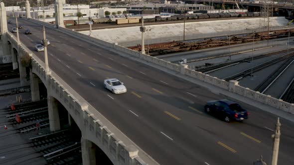 Commuting Concept - Cars Driving on Road into Downtown Los Angeles City. Aerial Establishing Drone V