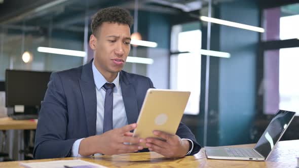 Young Businessman Doing Video Chat on Tablet in Office