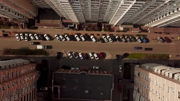 Top Down View of Fly Between Cityscapes in Downtown with Traffic