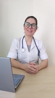 Friendly Doctor Gestures and Talks to the Camera