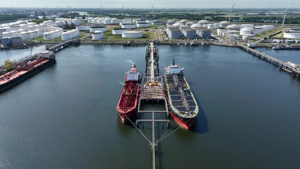 Crude Oil Tanker Ships Unloading Petrochemicals to a Shore Fuel Depot