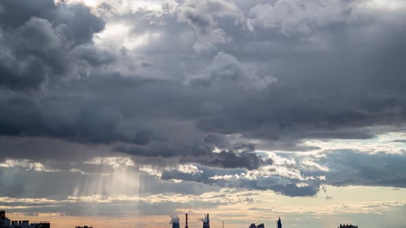 Sunbeams Through the Clouds in the Stormy Weather Timelapse