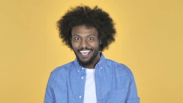 Yes AfroAmerican Man Shaking Head to Accept on Yellow Background