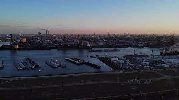Skyline Of Rotterdam And Sea Harbour Of Maasvlakte During Sundown. aerial