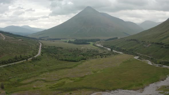 Rising establishing shot of mountains in the Scottish highlands