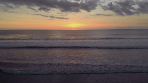 Flight at Sunset Overlooking the Indian Ocean in Bali Indonesia