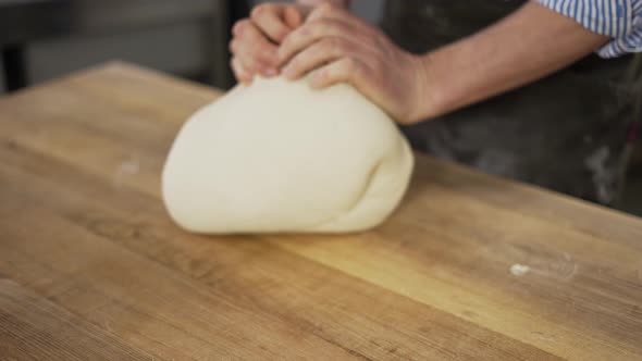 Closeup Shot of Hands of Senior Bakery Chef Applying Flour on Dough Aged Man Kneading Dough Making