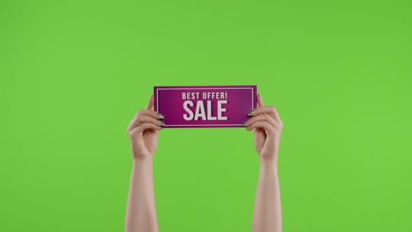 Best Offer Sale Advertisement Inscription on Paper Sheet in Womans Hands on Chroma Key. Slow Motion