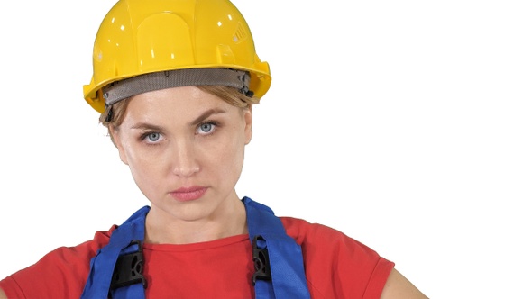 Proud confident young woman worker with arms on hips on