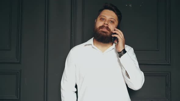 Man Talking On Phone