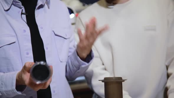 Barista Makes Coffee in Cafe