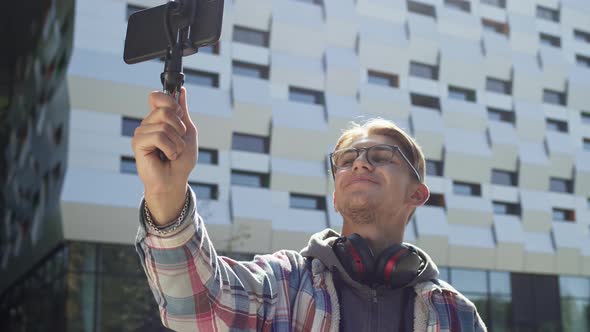 Cute Blond Guy On The Street Shoots Video On The Phone.