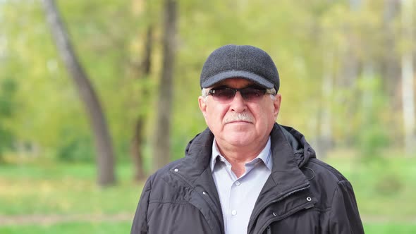 Senior Man with a Mustache in the Park