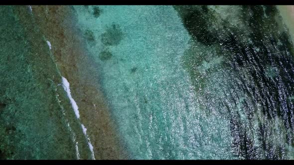 Aerial view panorama of luxury lagoon beach wildlife by transparent ocean with white sandy backgroun