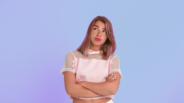 Young Woman with Pink Hair and Shiny Freckles Dressed in Top